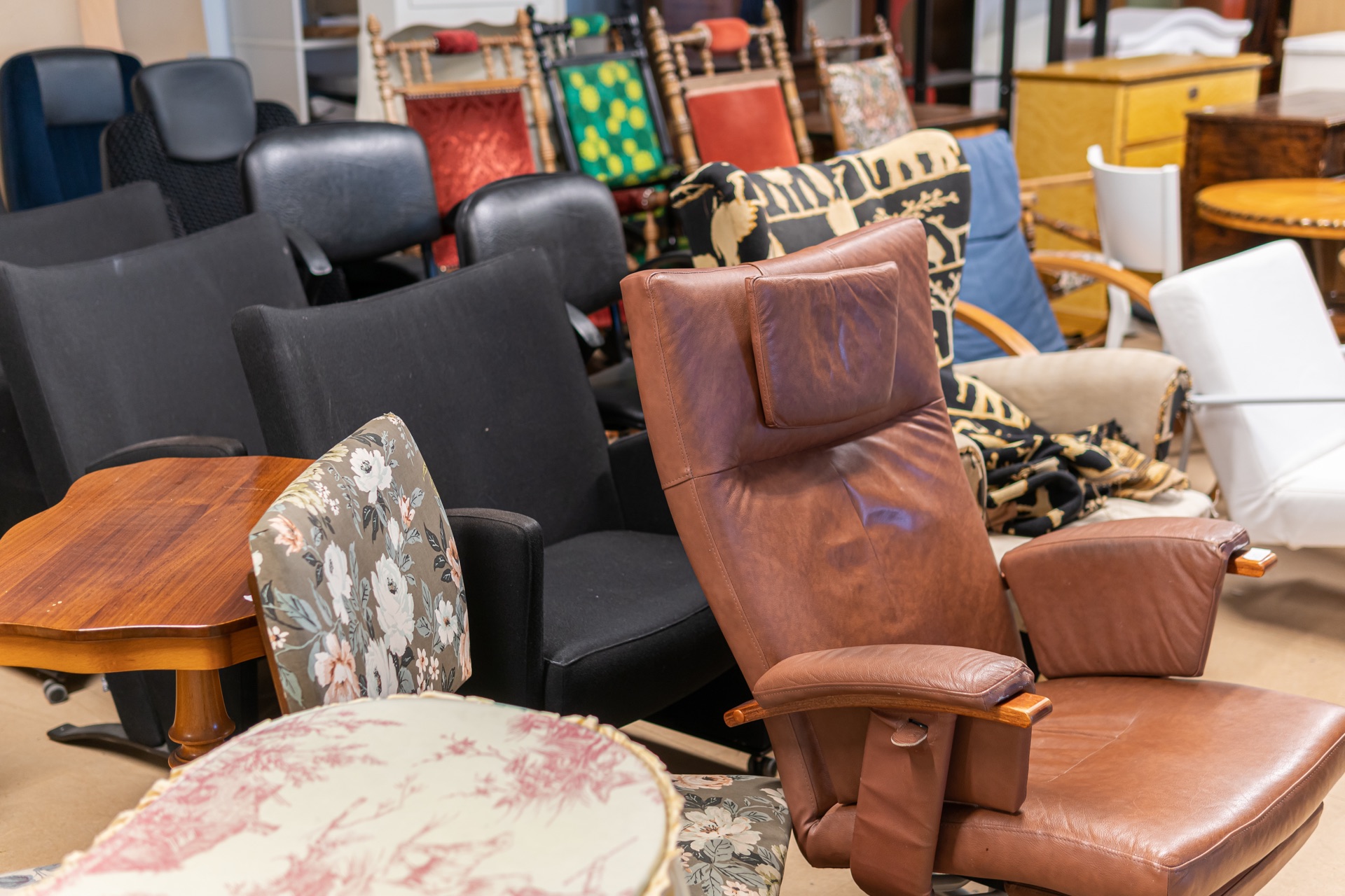 Collection of furniture set aside for donation, recycling, or disposal