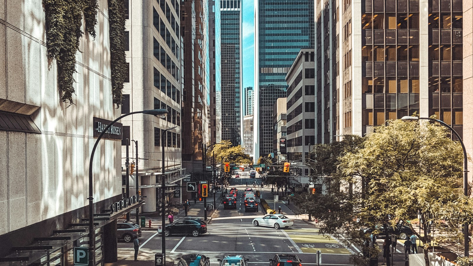 Downtown Vancouver street with traffic and office buildings